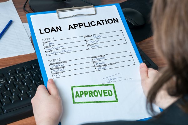 woman holding loan application form credit repair